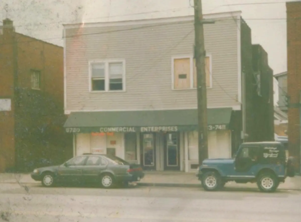 Close view of the Commercial Enterprises storefront on Fleet Avenue in 1984